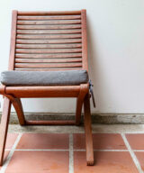 Patio chair with gray seat cushion