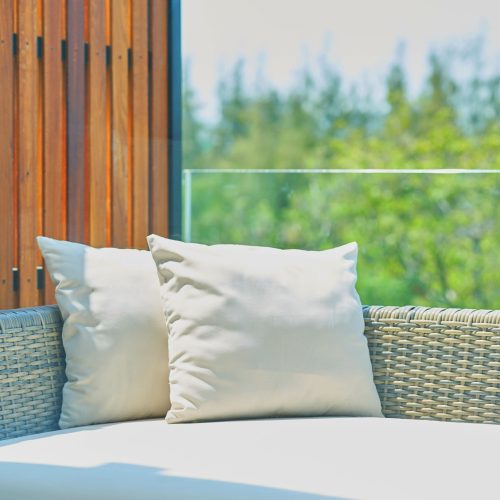 12 inch patio throw pillows sitting on outdoor sofa bed