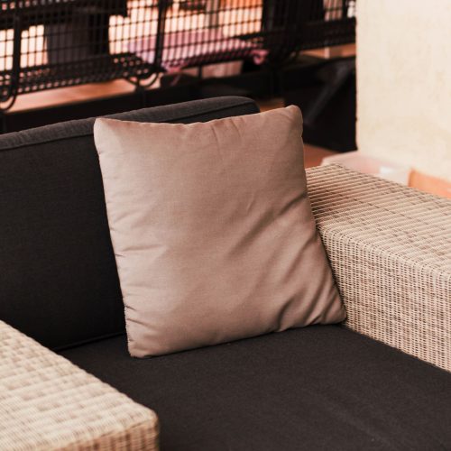 14 inch patio throw pillows sitting on outdoor furniture