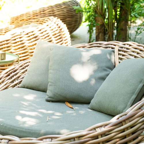 16 inch patio throw pillows sitting on outdoor furniture