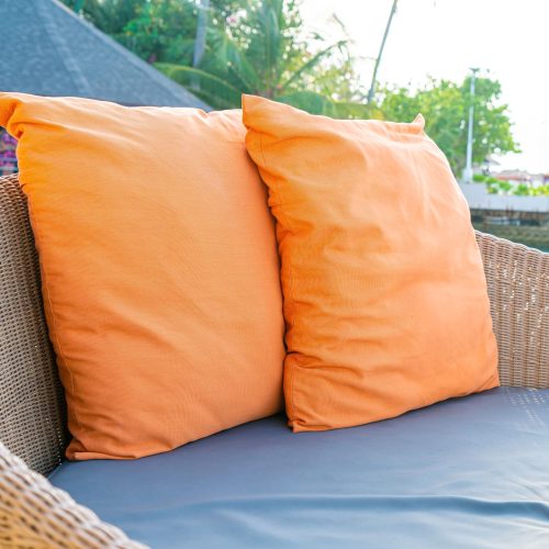 20 inch patio throw pillows sitting on outdoor furniture