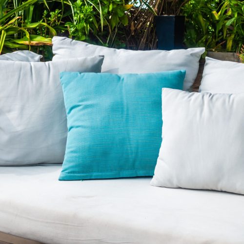 26 inch patio throw pillows sitting on outdoor furniture