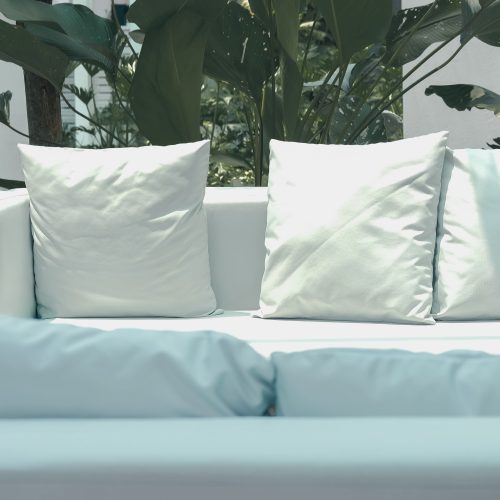28 inch patio throw pillows sitting on white outdoor sofa