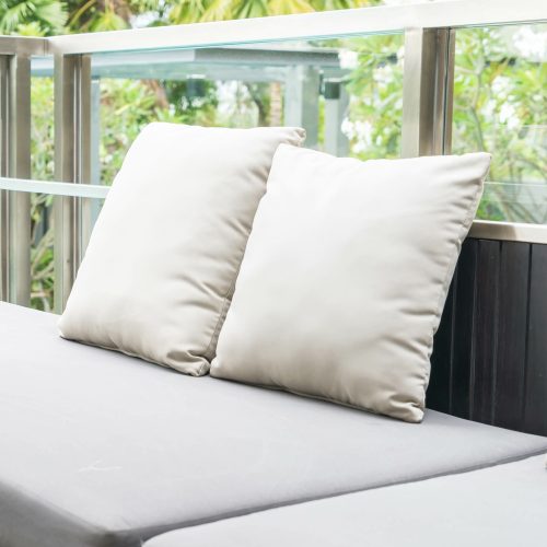 30 inch patio throw pillows sitting on outdoor furniture